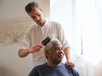 Man brushing man's hair