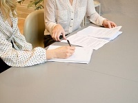 People working on a document