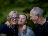 Family of three hugging